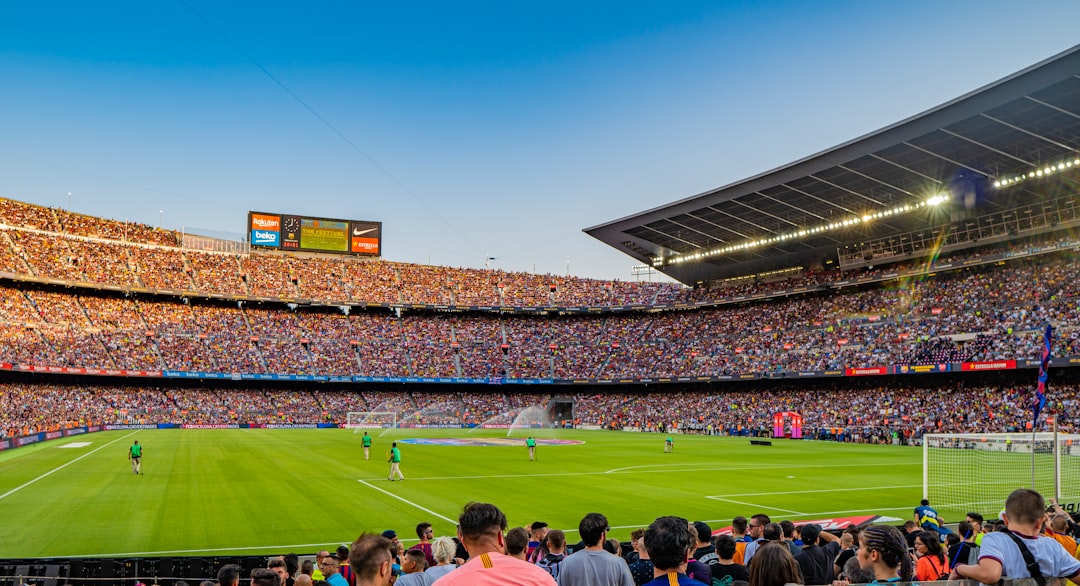 Packed football stadium at night under floodlights symbolising the scale of the FIFA World Cup 2026 opening ceremony