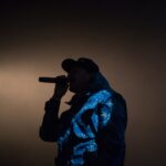tricksingh performing on stage – hip hop artist spotlight silhouette