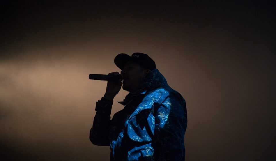 tricksingh performing on stage – hip hop artist spotlight silhouette